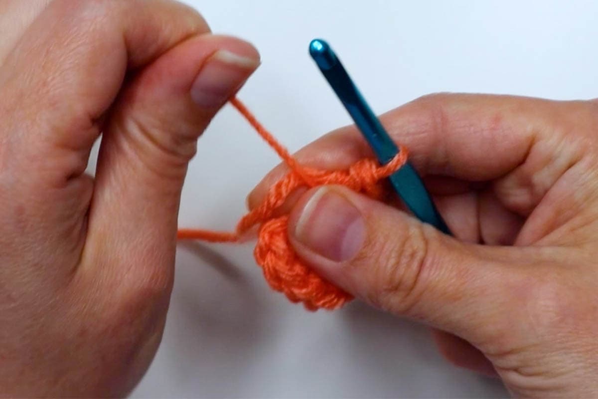 pull the end of the yarn to tighten the ring