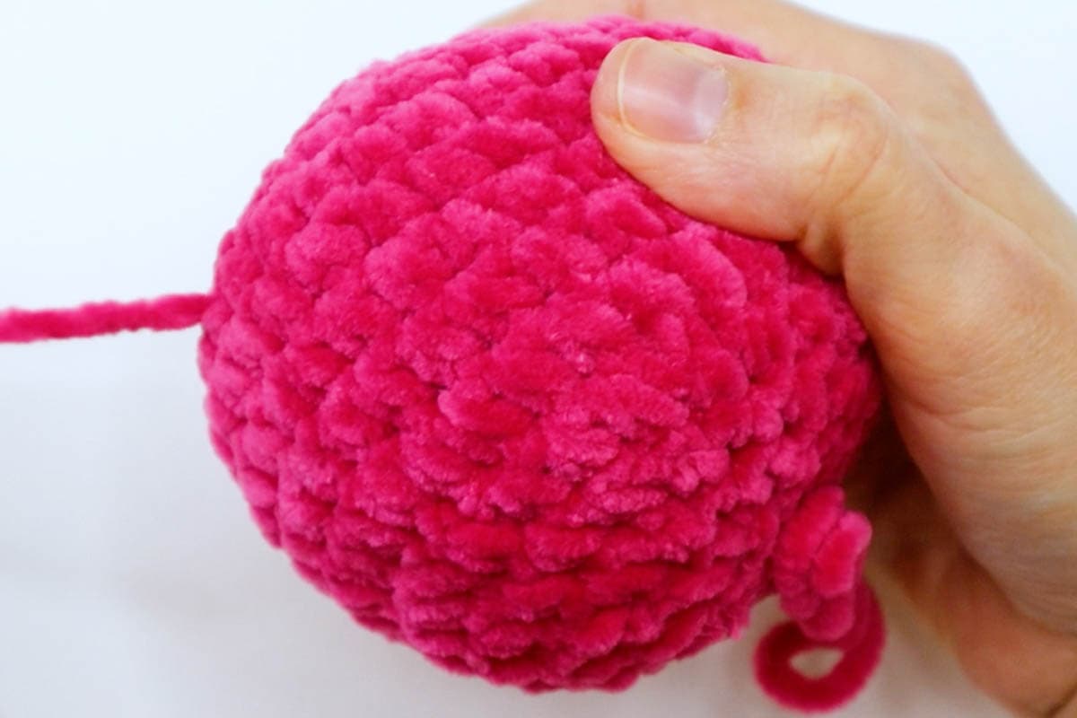 pull the yarn through the ball