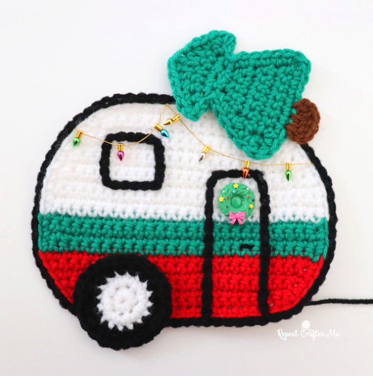 crochet mini RV camper ornament with a Christmas tree on top