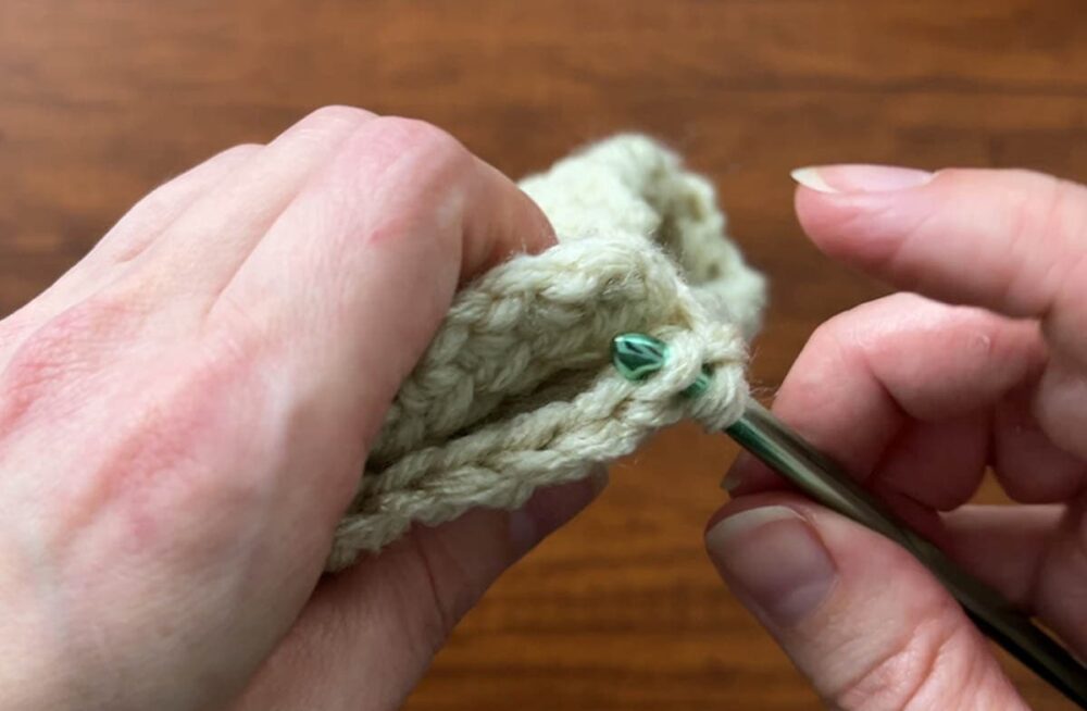 slip stitching the sides of the pumpkin together