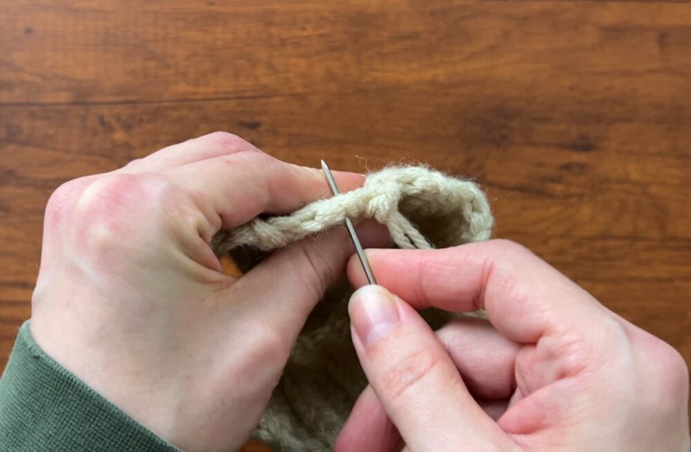 sewing the bottom of the pumpkin up