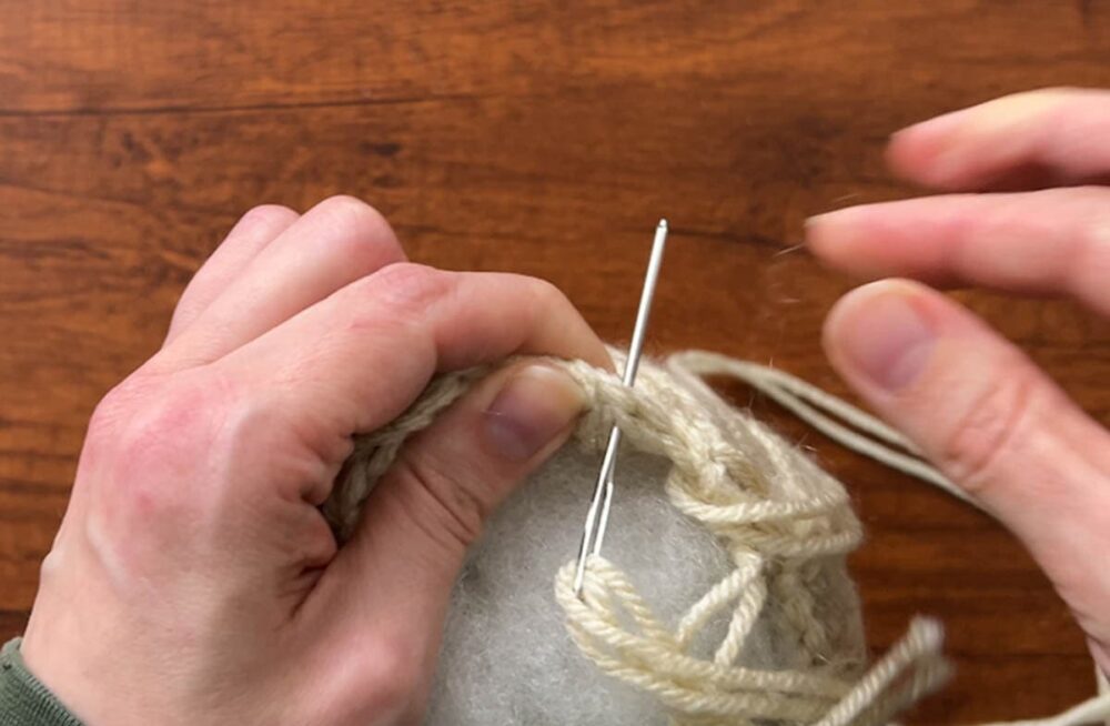 sewing up the top of the pumpkin