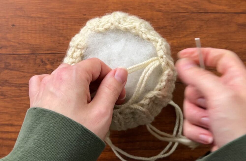 sewing up the top of the pumpkin