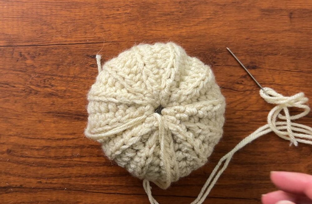 sewing up the top of the pumpkin