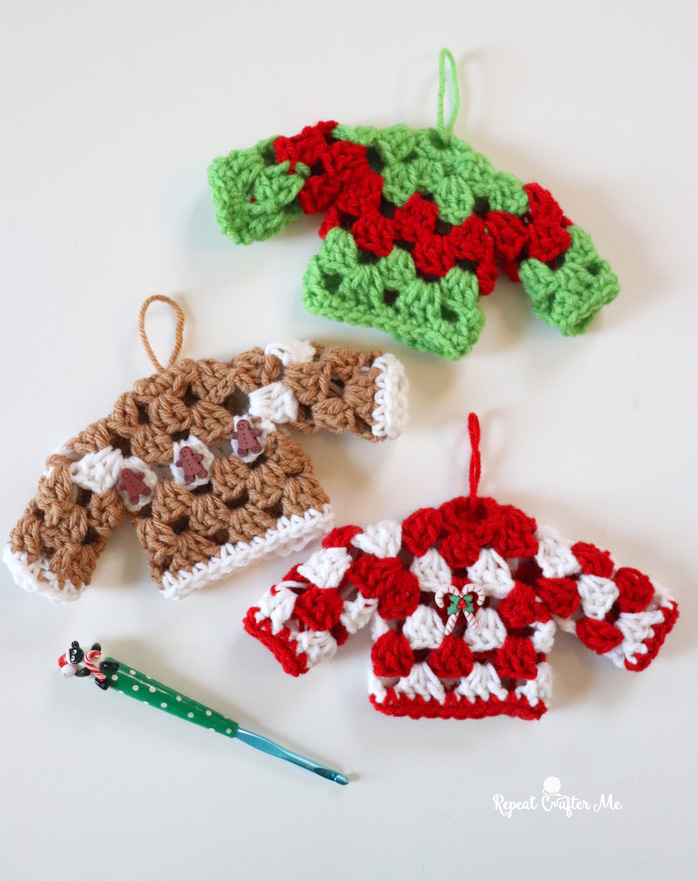 3 granny sweater crochet Christmas ornaments and a holiday themed crochet hook