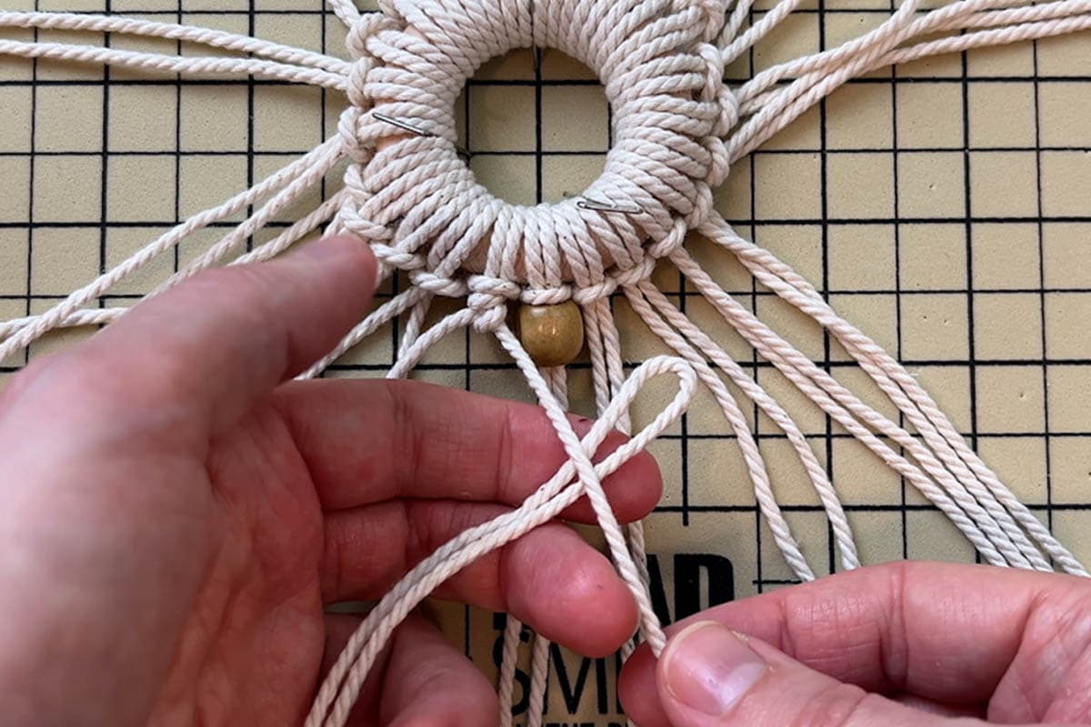 adding a short piece of cord to the filler cord with a cow hitch knot