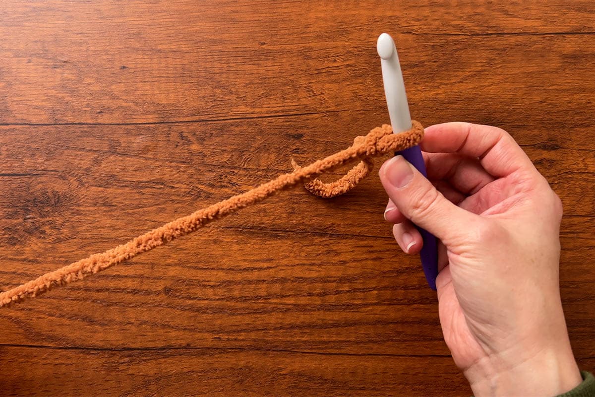 attach yarn to hook with a slip knot