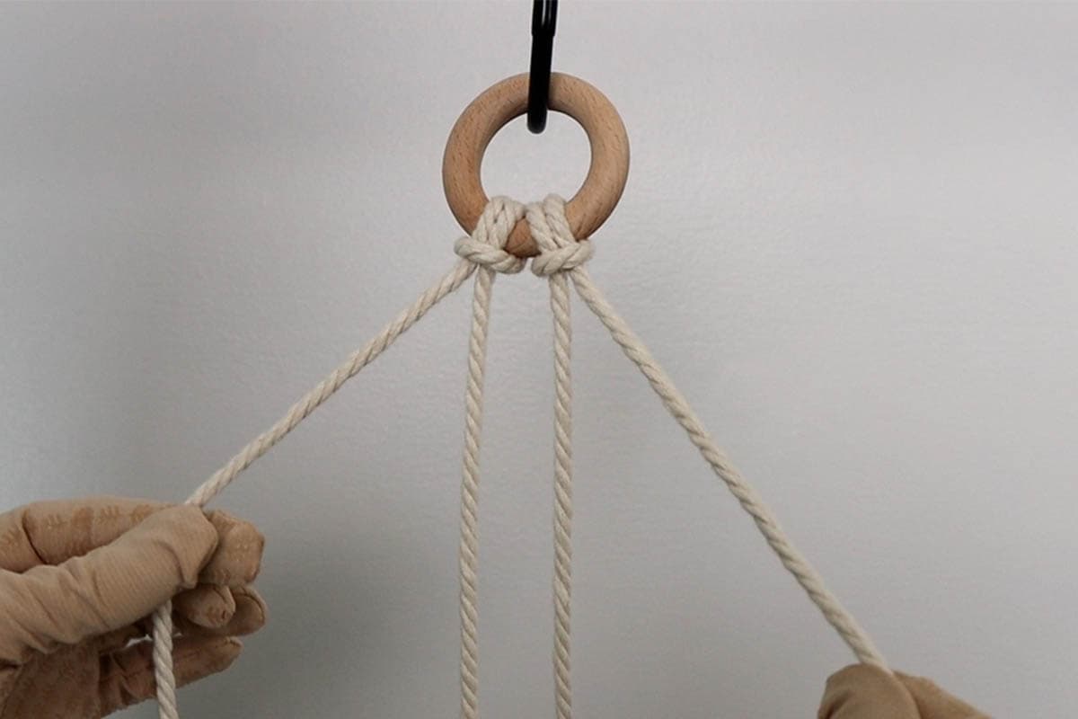 attaching cords to the ring for macrame plant hanger