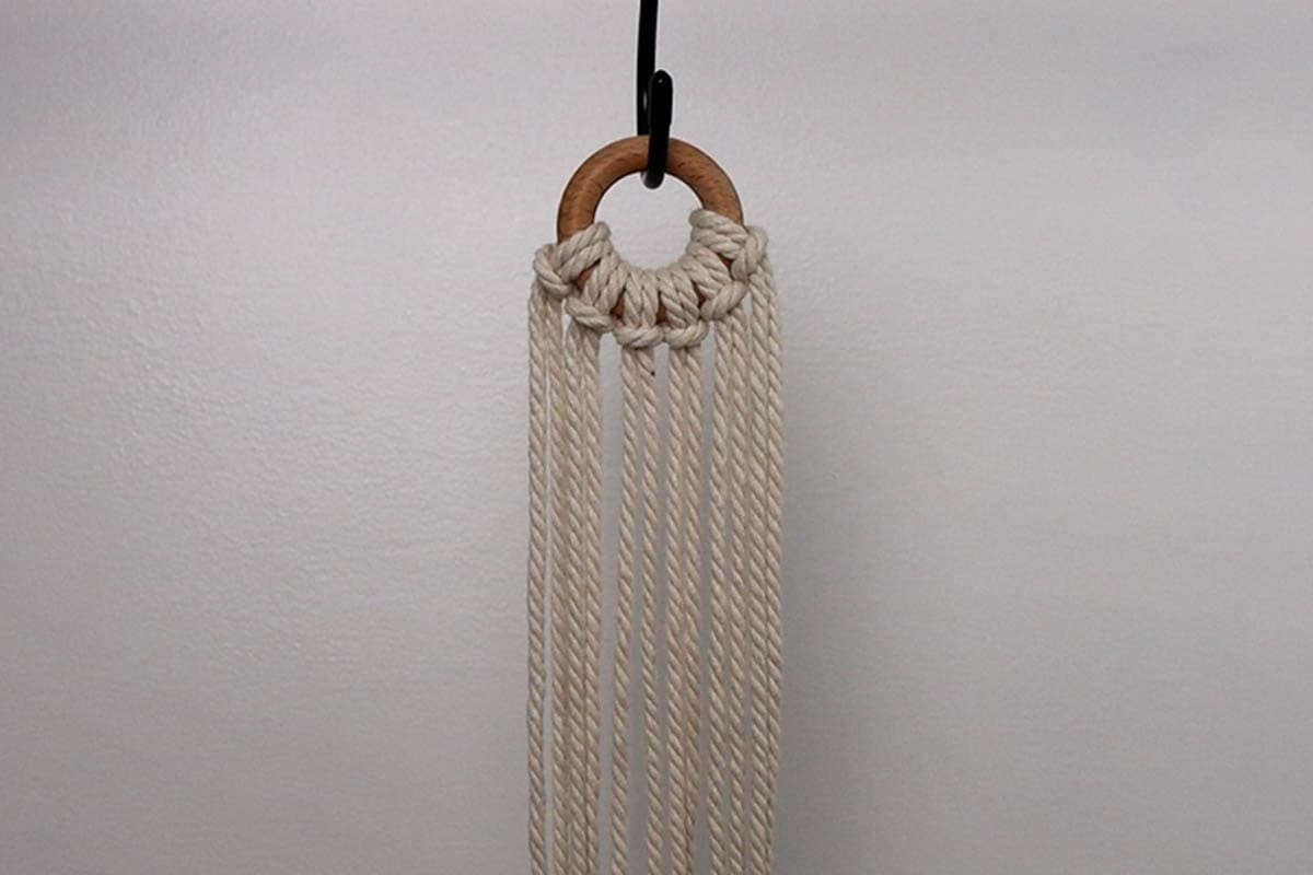attaching cords to the ring for macrame plant hanger