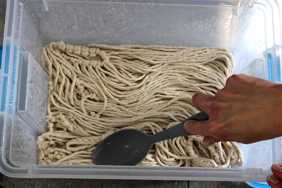 soaking the macrame plant hangers in soda ash solution