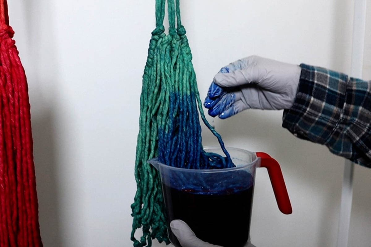 dip dyeing in the dark blue dye