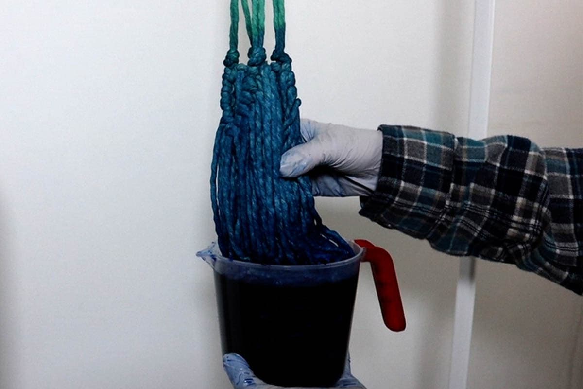 dip dyeing in the dark blue dye