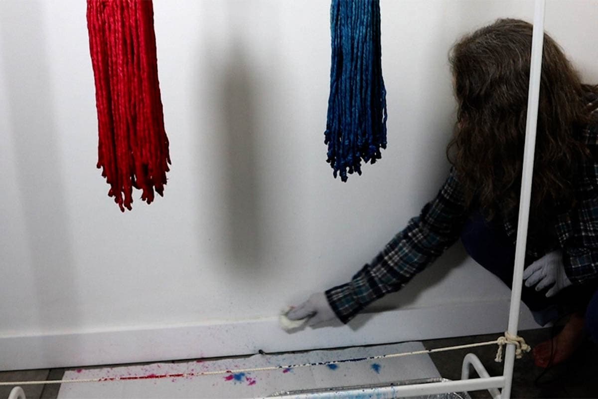 wiping up the wall from the dye splatters