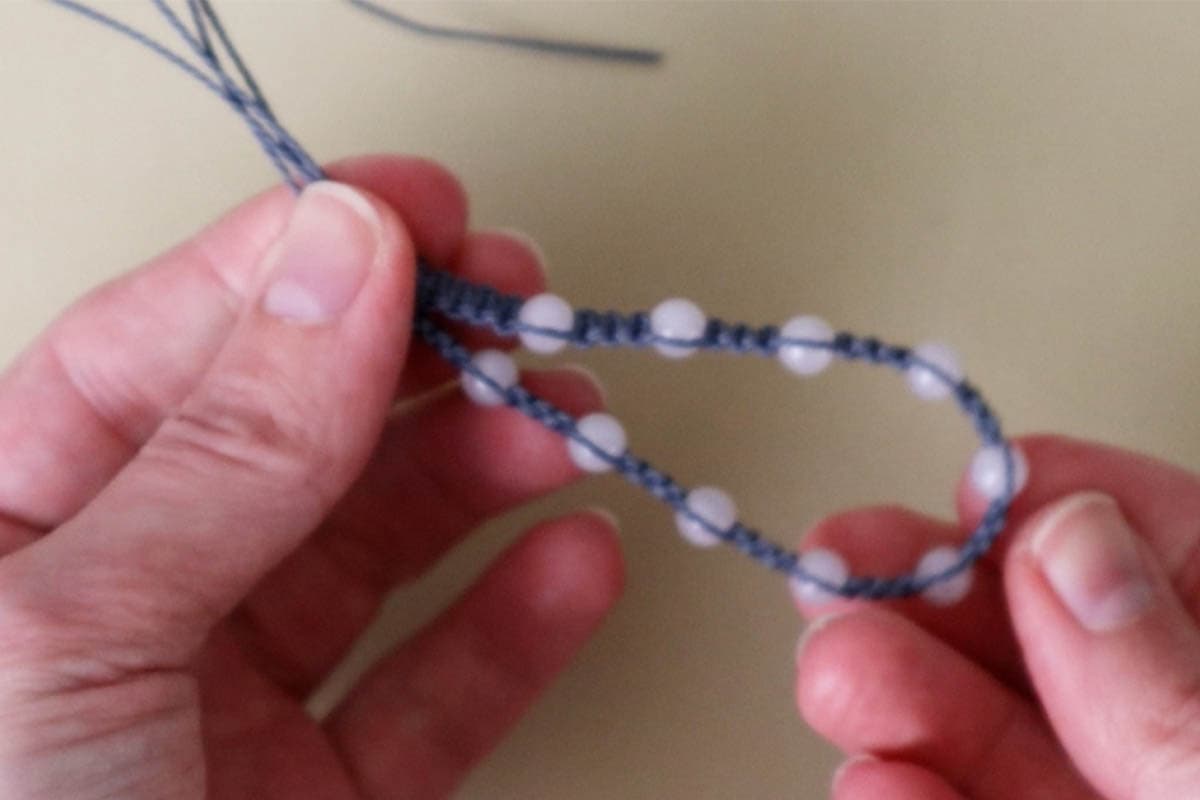 folding the bracelet in half to find the center