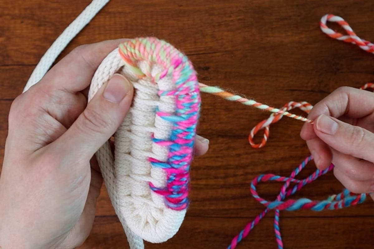 coiling along with the colorful yarn