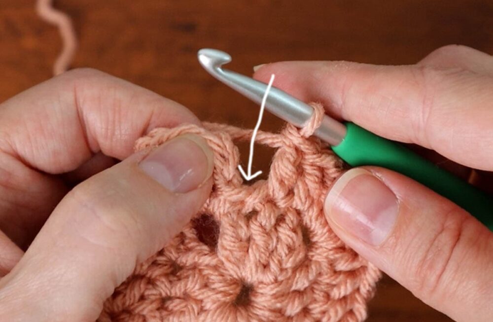 last double crochet of the round goes into this last stitch that's attached to the chain 3
