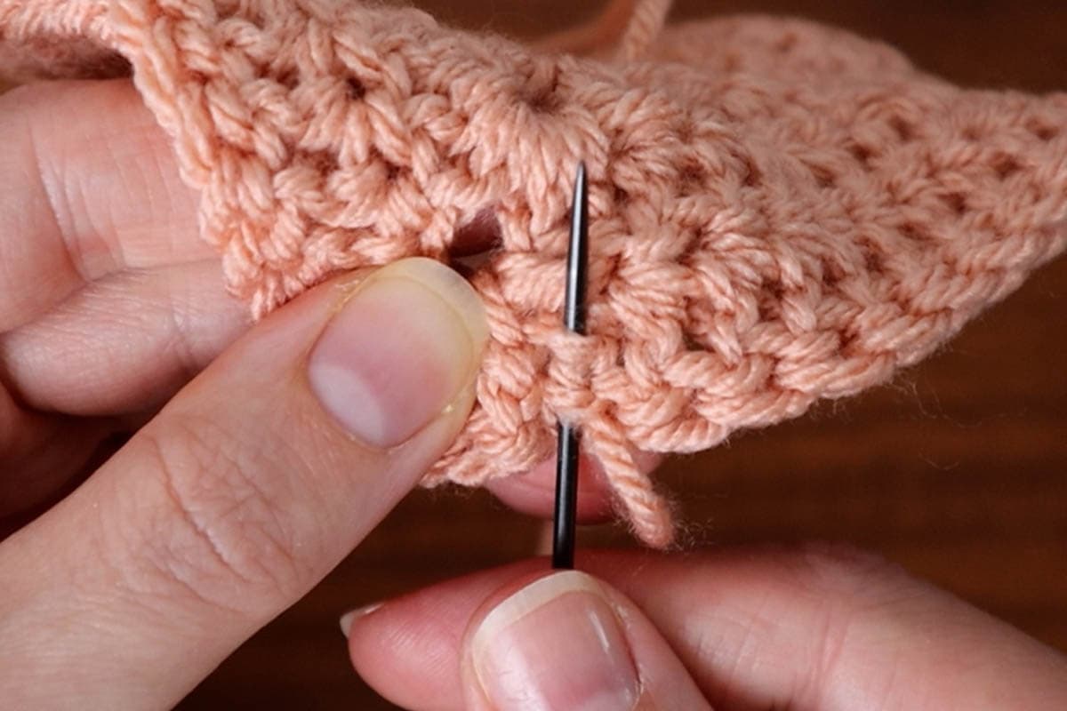 weaving in the yarn tail after doing the invisible join